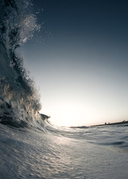 Large colorful shore break wave