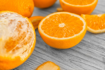 Fototapeta na wymiar Fresh ripe oranges on wooden background