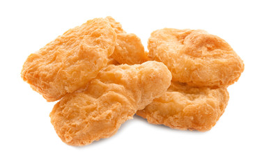 Tasty chicken nuggets on white background
