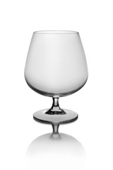 Empty Brandy glass isolated on white background with shadows