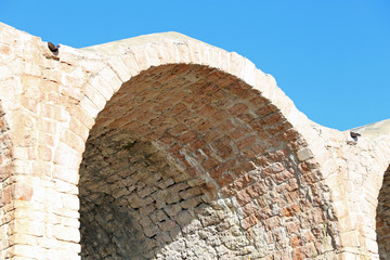 ancient arcade made with red bricks