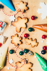Preparing Christmas cookies as gift, with christmas decoration and wooden background, top view.