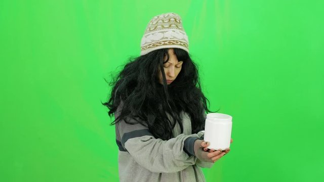 Hobo young woman beg for money with jar green-screen close-up