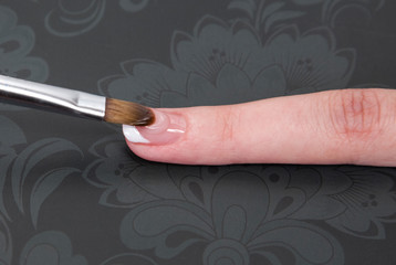 Manicure in beauty salon. Finger closeup 

