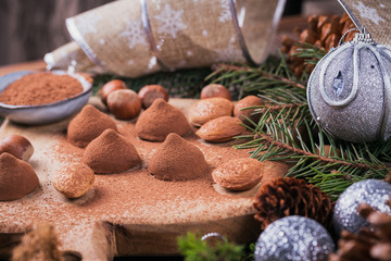 Homemade chocolate truffles, nuts, almonds and cocoa powder