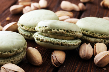 Sweet and colourful french macaroons or macaron on wooden background, Dessert