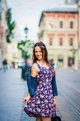 Fototapeta premium Funny girl walking along the street
