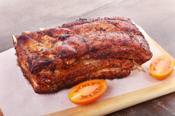 grilled pork chops with tomato and ketchup on plate.