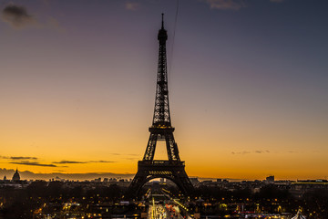A spectacular golden dawn and the Eiffel tower.