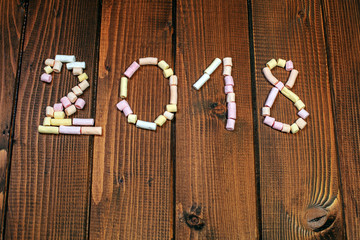 Inscription 2018 from marshmallow. Concept of Merry Christmas, New Year, winter, holiday, greetings.