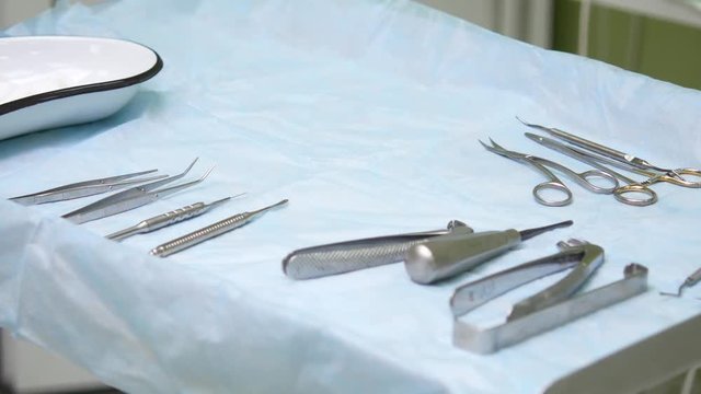 Dental office. Preparing for surgery, tools are laid out on a sterile table