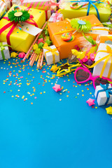 Colored gift boxes with colorful ribbons. Orange background. Gifts for New Year or a birthday.