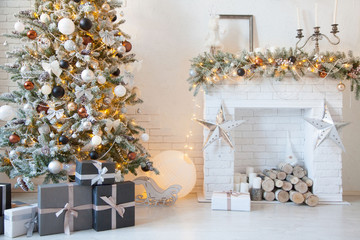 Christmas interior of a house with a white Christmas tree.