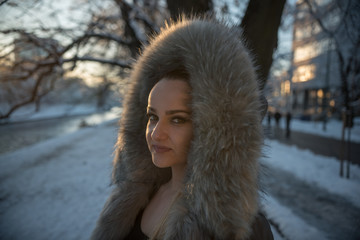 beautiful woman in winter coat with fur