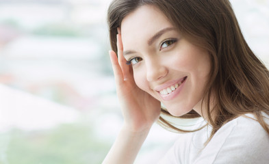 Beauty smiling model with natural make up and long eyelashes