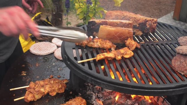 barbecue Livar pork chicken kebab turning the meat