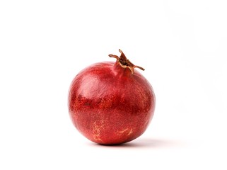 Ripe Red Pomegranate on the White Background