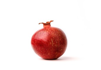 Ripe Red Pomegranate on the White Background