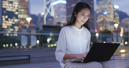 Business woman work on laptop computer at outdoor