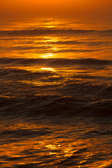 Fototapeta na wymiar Beatiful red sunset over sea surface
