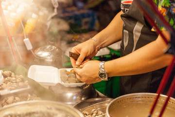 Man prepare clams for sale