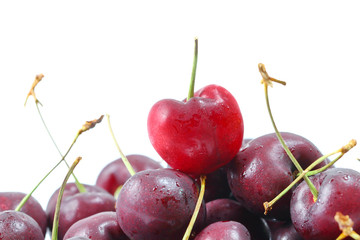 A close up of three red cherries
