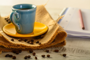 cofee cup and coffee beans
