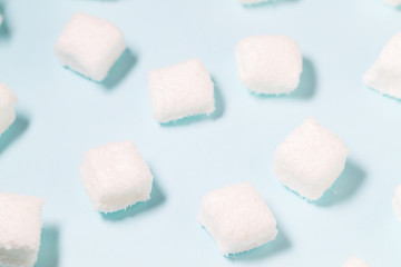 White Marshmallow candy on blue