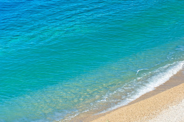 Sea view pebble beach and turquoise water tranquil scene
