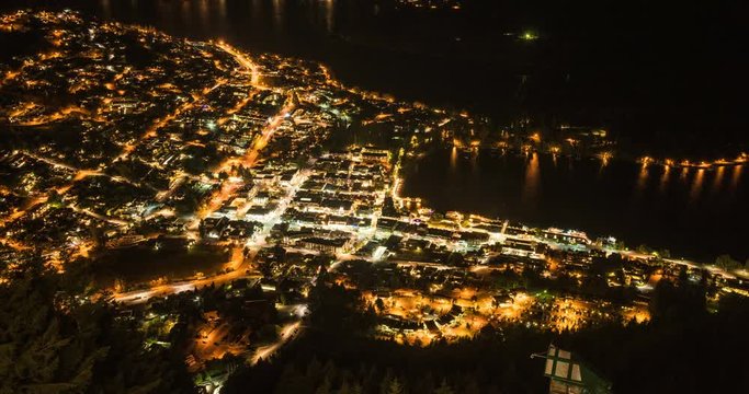 NEW ZEALAND – MARCH 2016 : Timelapse of Queenstown cityscape at night with harbour in view