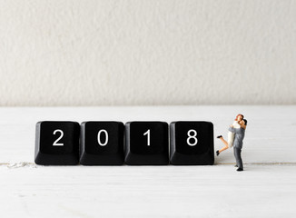 miniature people couple hugging with computer keyboard button 2018 new year concepts