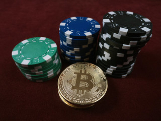 Bitcoin coins and poker chips. New virtual and real currency. The concept of replacement bitcoin in all forms of payment.