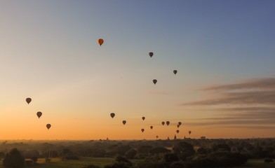 Balloons flying over Dhammayangyi Temple in Bagan Myanmar, Ballooning over Bagan is one of the most memorable action for tourists.