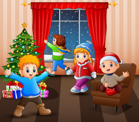 Happy kids in the living room with christmas and new year decoration