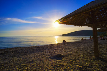 The evening sunset on the beach .