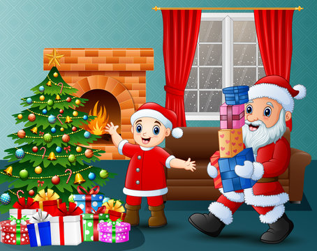 Santa bringing gift box and kid in the living room with christmas and new year decoration