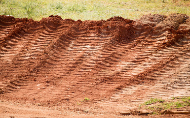 Traces from the car on the red clay soil