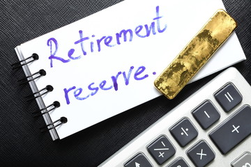 Notepad paper with hand writing text and gold bar.