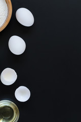 Ingredients for cooking on black background. Recipe of Russian pancakes