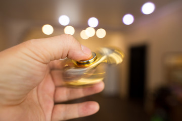The golden spinner is spinning in his hand