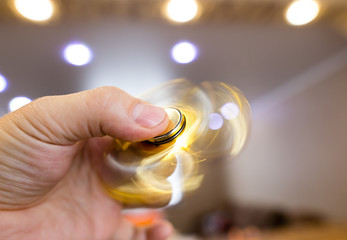 The golden spinner is spinning in his hand