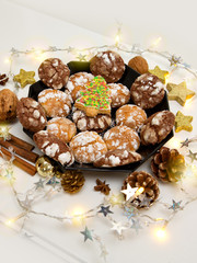 Chocolate Christmas Cookies with decoration and fir tree isolated.