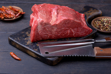 Large piece of meat on cutting board