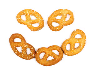 Salty handmade pretzels isolated on white background, top view