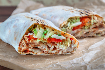 Roll with chicken and vegetables. Shawarma. Fast food. - 184786506