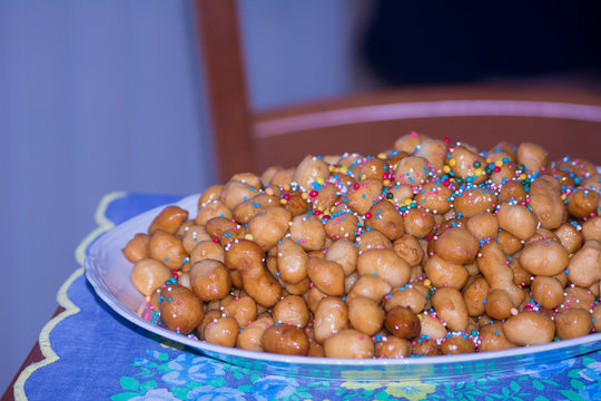 Close Up Of Traditional Italian Food Called Strufoli On Blur Background