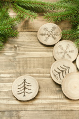 Christmas or New Year homemade pyrography toys. Wooden slice. Christmas decorations. Close up.