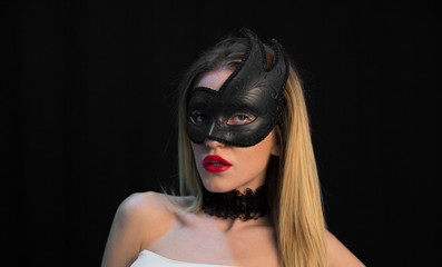 Young Mystic woman posing in mask