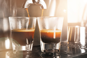 close up of coffee machine preparing cup of coffee