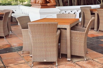 table and chairs beside pool
